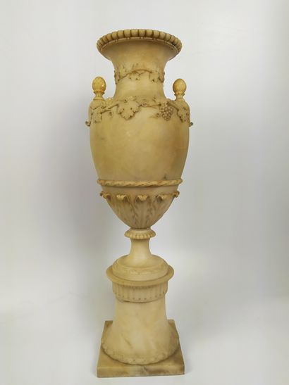 null Antique alabaster vase, carved in relief with bunches of grapes, water leaves,...