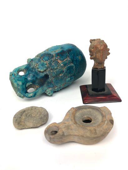 null Set of FOUR DIGGING OBJECTS, including : - a terracotta head (Height 4 cm, restored)...