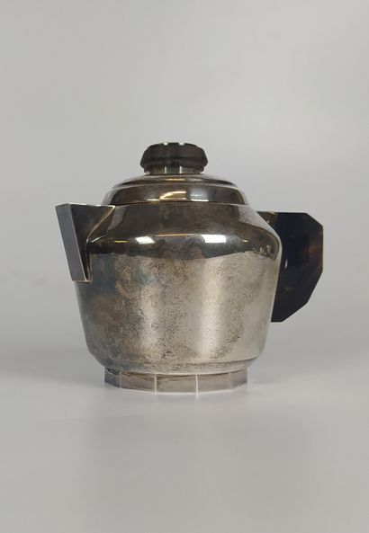 null A plain silver COFFEE SERVICE including a coffee pot, a teapot, a covered sugar...
