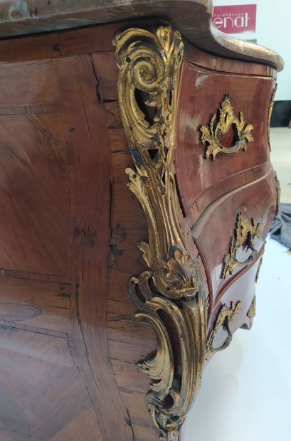 null A tomb-like chest of drawers in veneer and marquetry, opening in front with...