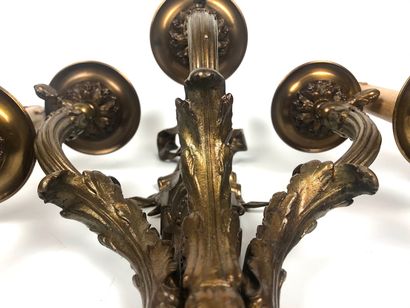 null A suite of FOUR ormolu and varnished sconces with three moving lights decorated...