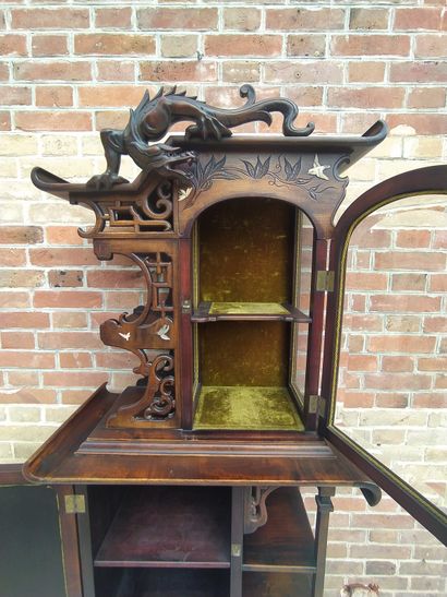 null INDOCHINA Wooden display case opening in front of a door and a glass door, decorated...