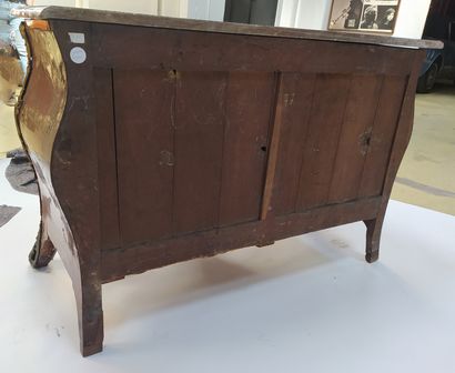 null A tomb-like chest of drawers in veneer and marquetry, opening in front with...