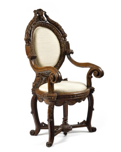  A carved and stained walnut APPARATUS CHAIR,...