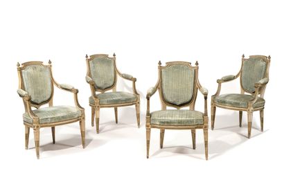 A SET OF FOUR painted wood armchairs with...