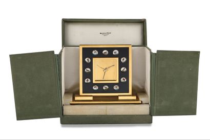  MELLERIO DITS MELLER About 1960. Gilt brass desk clock with alarm function, made...
