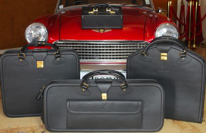 BAGAGES SCHEDONI 
POUR FERRARI Set of four matching black leather luggage with removable...