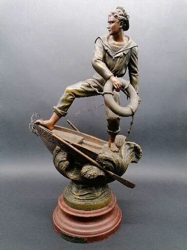 L. RAPHAEL BOARDING

Subject in patinated regula 

On a wooden base painted in imitation...