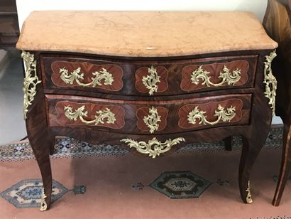 null CHEST OF DRAWERS

in veneer and gilt bronze ornaments opening with two drawers....