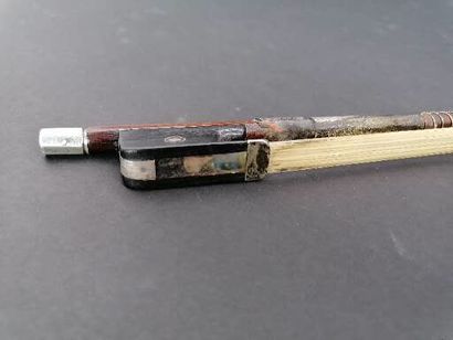 null POIRSON IN PARIS

Violin bow 

Silver and mother of pearl inlay 

Signature...