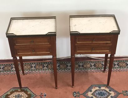 null PAIR OF BEDSIDE TABLES 

Louis XVI style 

Opening with two drawers 

Marble...