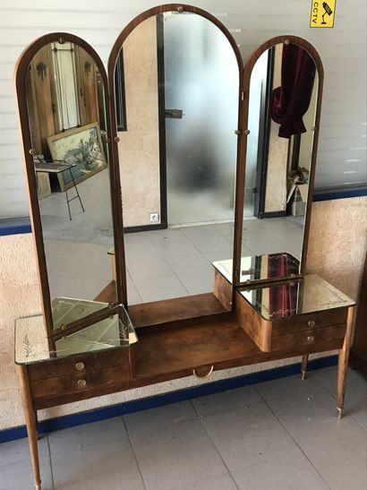 null TRIPTYCH DRESSING TABLE 

opening with four drawers in front, gilded brass ornaments

Circa...