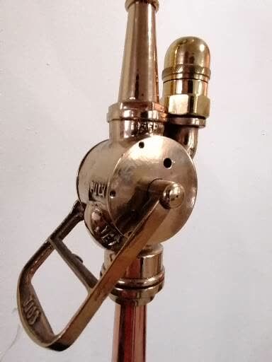 null Curious LAMPADAIRE

made of an old copper and brass fire hose mounted on a black...