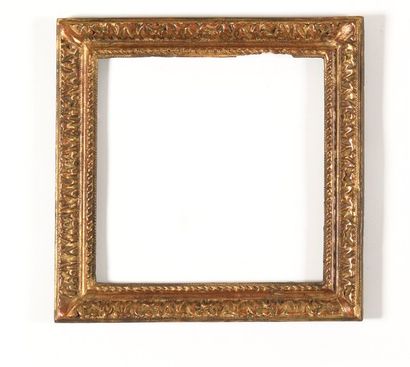 null A SET OF THREE FRAMES in carved and gilded wood decorated with staples and foliage....