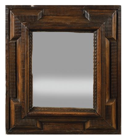 null A carved walnut frame with wavy decor and a doucine, Flanders, end of the 17th...