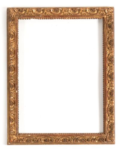 null SET OF THREE FRAMES in carved and gilded wood with friezes presenting acanthus,...