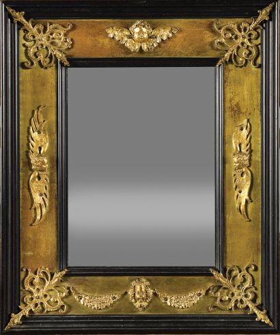 null Rectangular mirror in blackened wood decorated with bronze plates decorated...