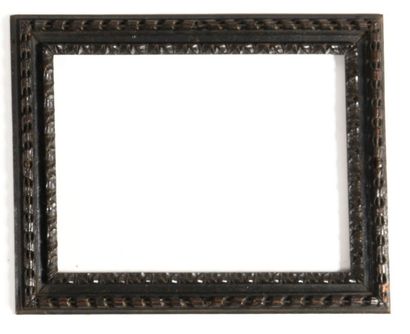 null A SET OF THREE FRAMES in carved wood with scrolls, acanthus and rais-de-coeur...