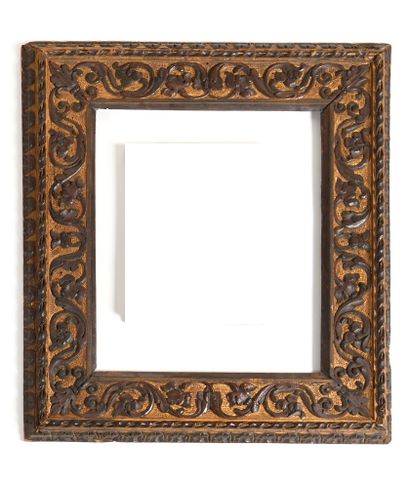 null A SET OF THREE FRAMES in carved wood with scrolls, acanthus and rais-de-coeur...