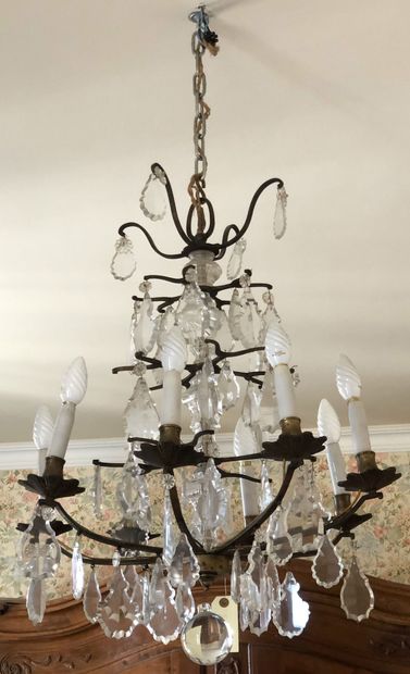 null LIGHTING in patinated bronze with eight arms of light on a row of facetted crystal...