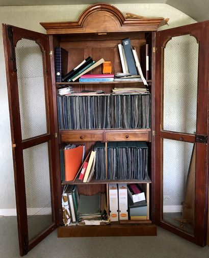 null Bookcase in cherry wood veneer on fir and amaranth net. 	 It opens to two doors...