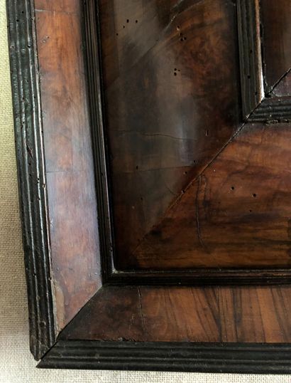 null Rectangular walnut veneered mirror with ebony mouldings. 17th century. H. 93...