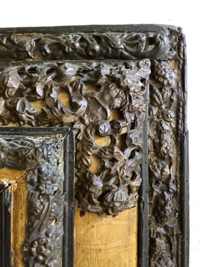 null MIRROR in stained wood with rich ornamentation of openwork, embossed and chased...