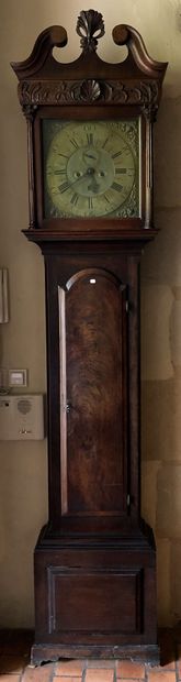 null A mahogany and mahogany veneer sheath clock with gusseted legs Signed William...