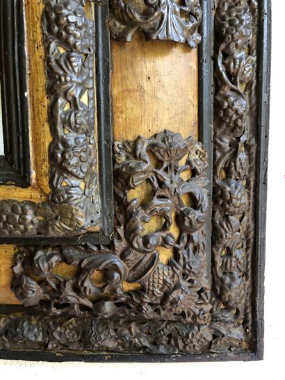 null MIRROR in stained wood with rich ornamentation of openwork, embossed and chased...