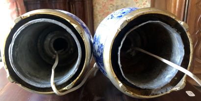 null PAIR OF VASES in blue and white earthenware in the Delft taste Mounted in lamps...