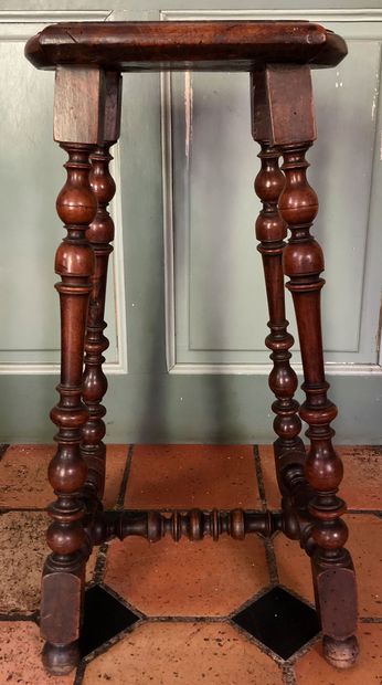 null A CHANTRE TABOURET in moulded and turned walnut. 								 XVIIth century H....