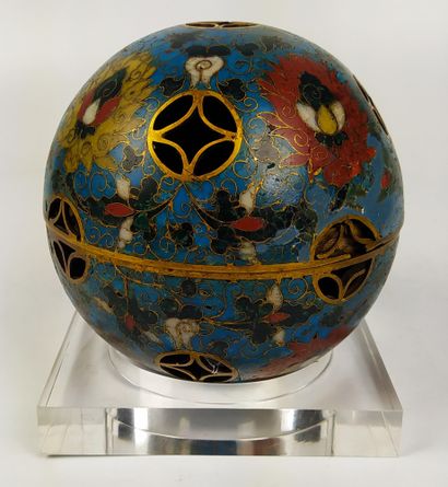 null CHINA A gilt bronze and cloisonné openwork sphere, opening in its center and...