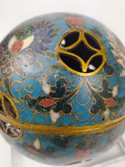 null CHINA A gilt bronze and cloisonné openwork sphere, opening in its center and...