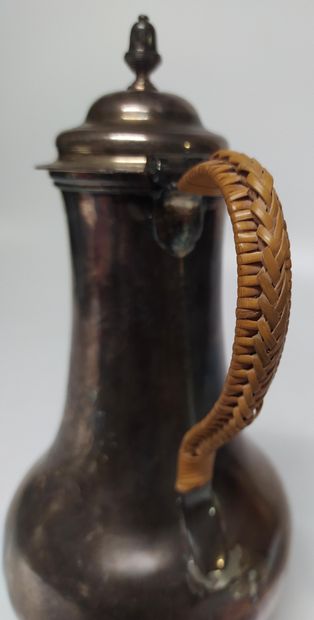 null A plain silver JUG, the body chased with a coat of arms, the handle in rope...