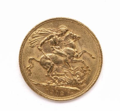 null PIECE en or jaune 900 millièmes présentant à l'avers le buste du roi Georges...