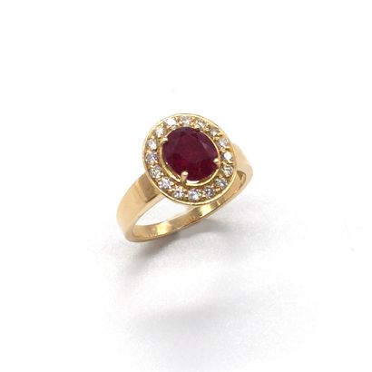 null RING "PIGEON'S BLOOD FREE RUBY" holding a 2.08 carat oval "Pigeon's Blood" ruby...