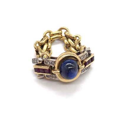 null RING decorated with a cabochon sapphire set in a closed setting surrounded by...