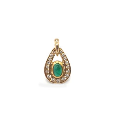 null 18K yellow gold pendant holding a cabochon emerald in a setting of brilliant-cut...