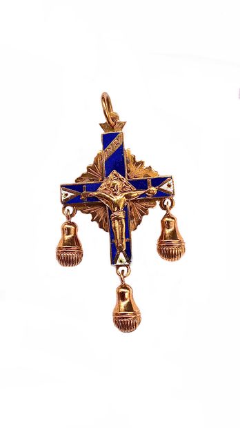 PENDANT in the shape of a cross presenting...