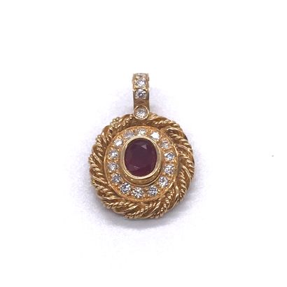 PENDANT adorned with a central ruby in a...