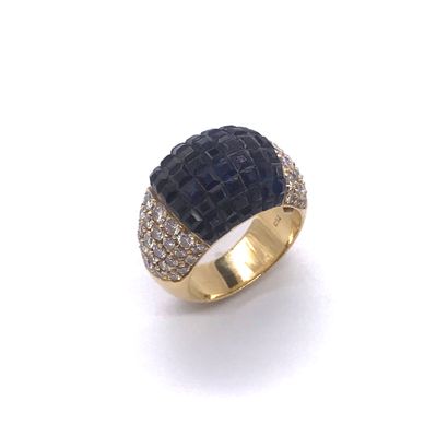 null RING presenting a dome decorated with a paving of calibrated sapphires (one...