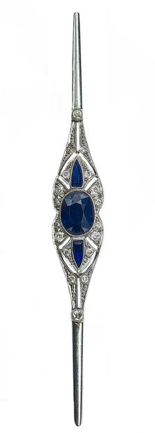 null ART DECO brooch holding a central sapphire of about 2 carats surrounded by a...