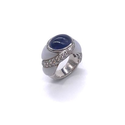 MAUBOUSSIN RING holding a sapphire cabochon...
