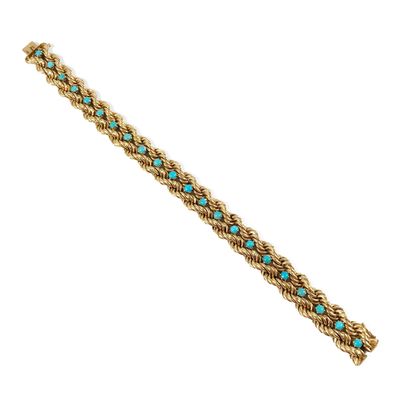 null Braided rope bracelet with turquoise cabochon. Mounting in 18K yellow gold....