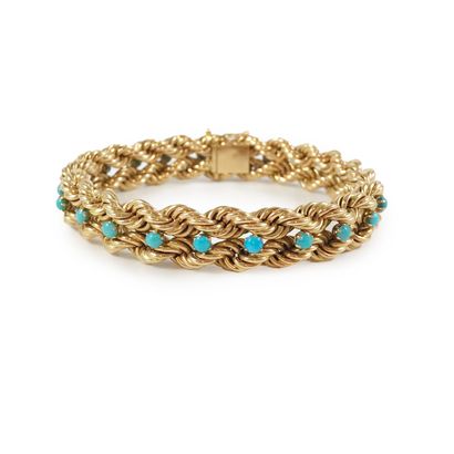 null Braided rope bracelet with turquoise cabochon. Mounting in 18K yellow gold....