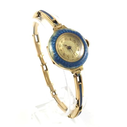 null WATCH with blue enamel bezel. Mechanical movement with manual winding. Bracelet...