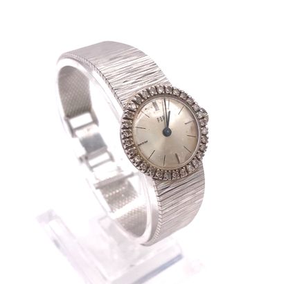 null 
WATCH
with a silvered back, bezel adorned with brilliant-cut diamonds, baton...