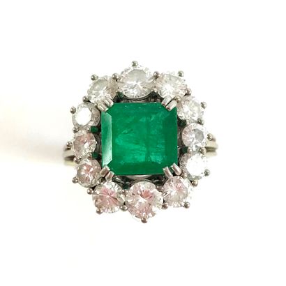 RING set with an emerald of about 2 carats...