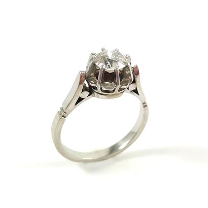 null 
SOLITAIRE RING
holding an old cut diamond of about 0.75 carat. Set in 18K white...