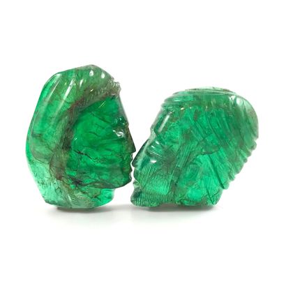 null 
RARE EMERALDS

presenting the profiles of a man and a woman. 

Woman's head...